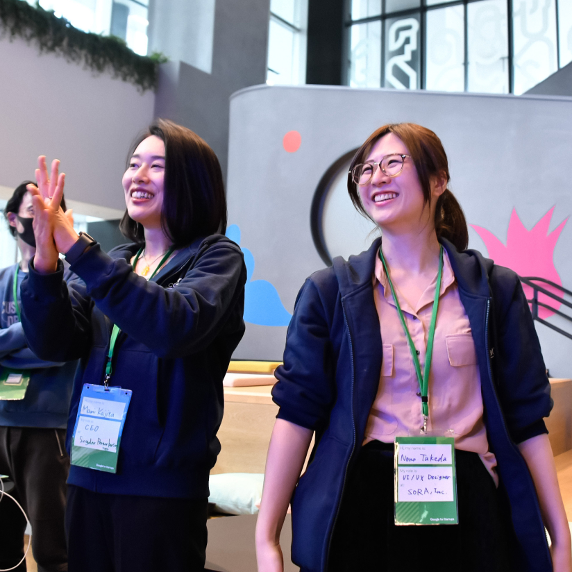 Conference with happy women smiling and looking at camera