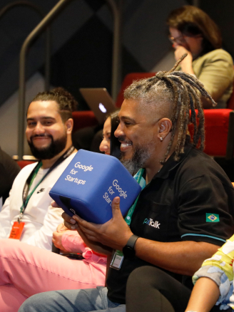 A man holding google for startups box.