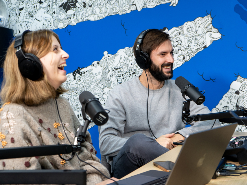 a woman and a man with mic