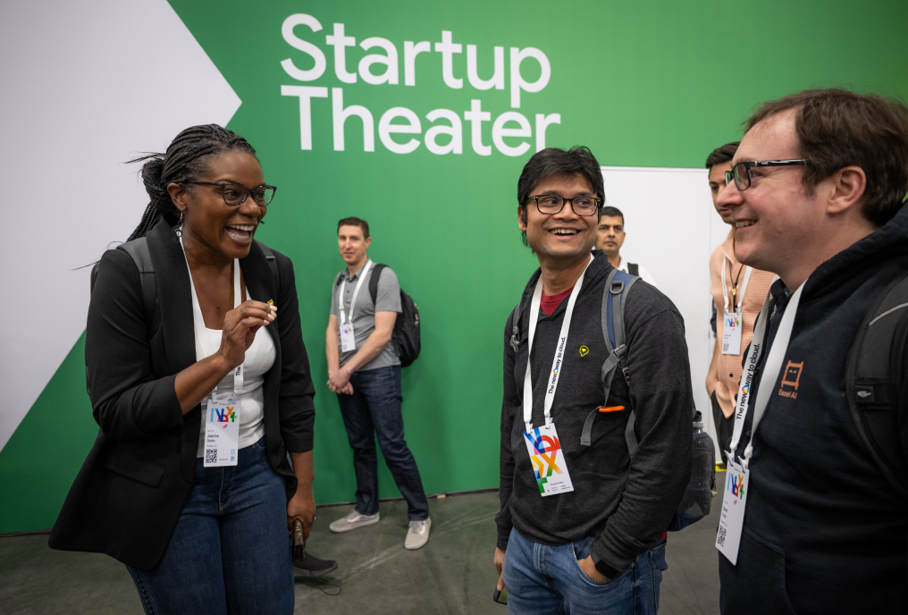 A group of people engaged in cheerful discussion.