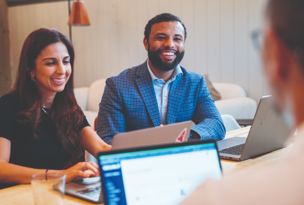 A man and woman smiling