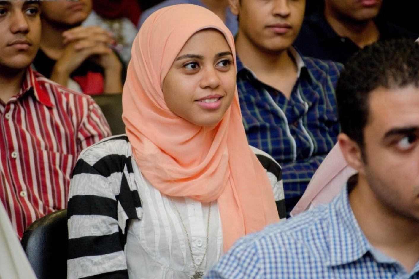 A smiling girl in focus