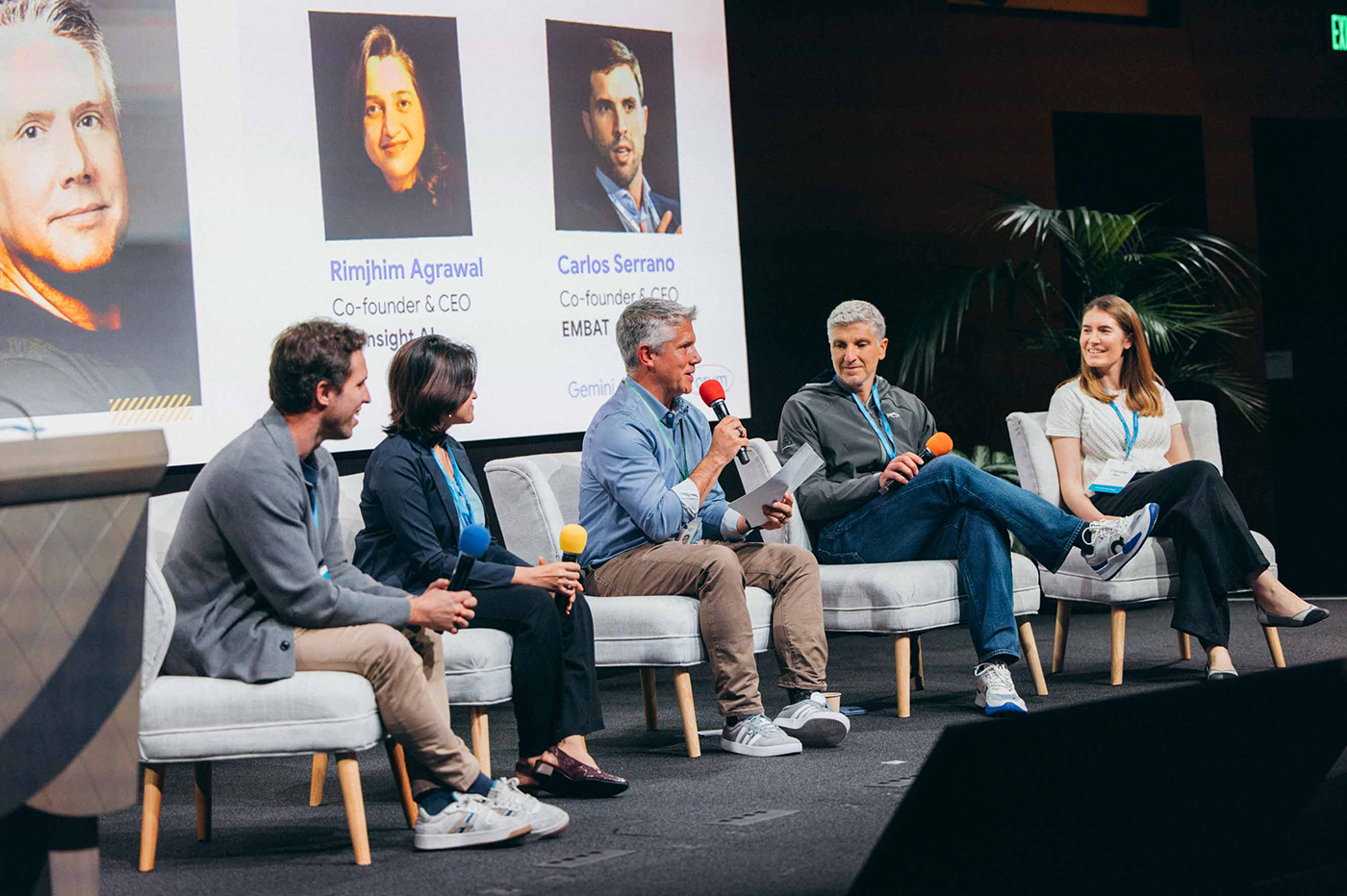 Couple of men and women discussing cybersecurity.