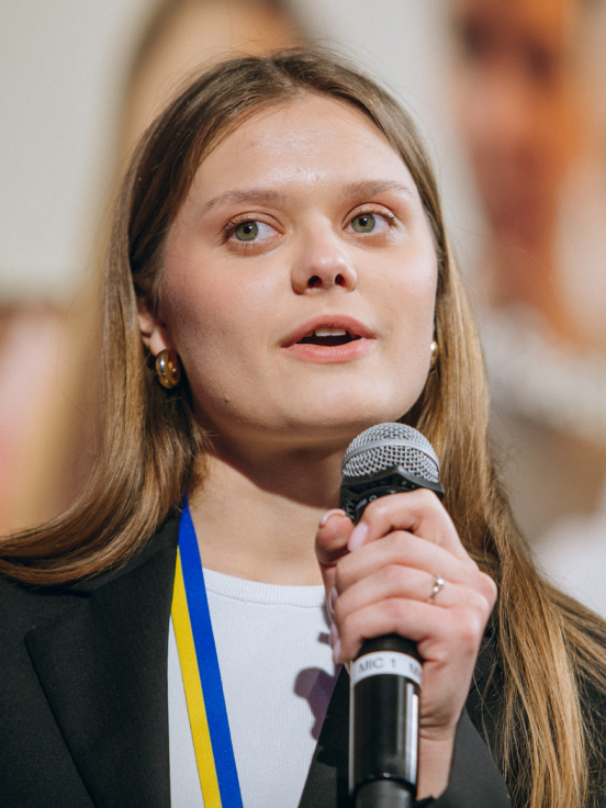 Woman holding a mic.