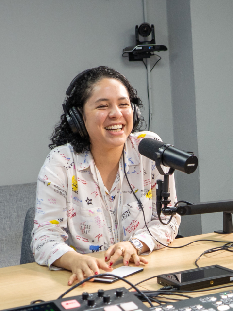 A happy woman with a microphone