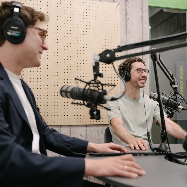 Two men podcasting.