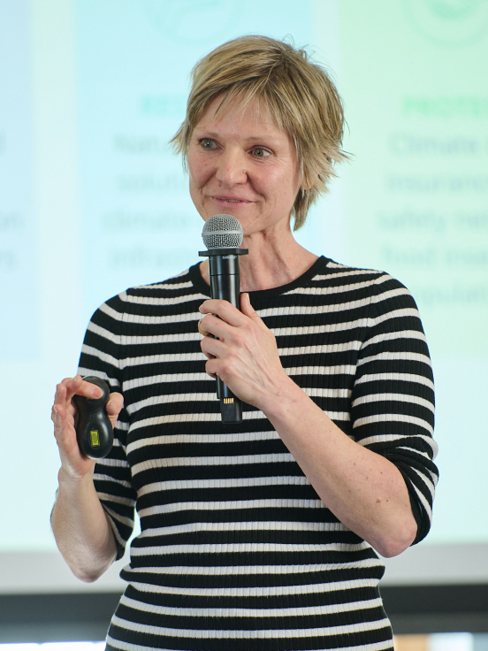 A woman holding a mic in her hand.