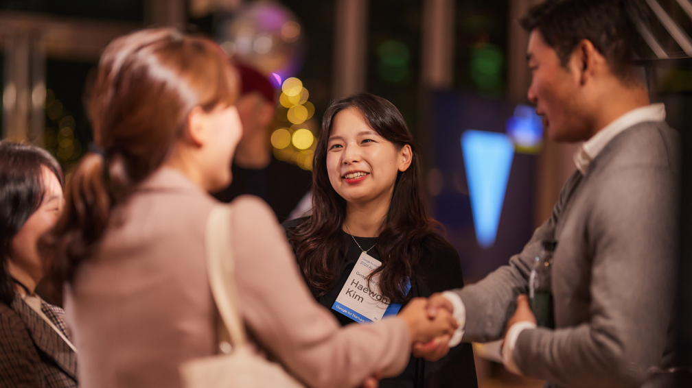 Two People Meeting Shaking Hands