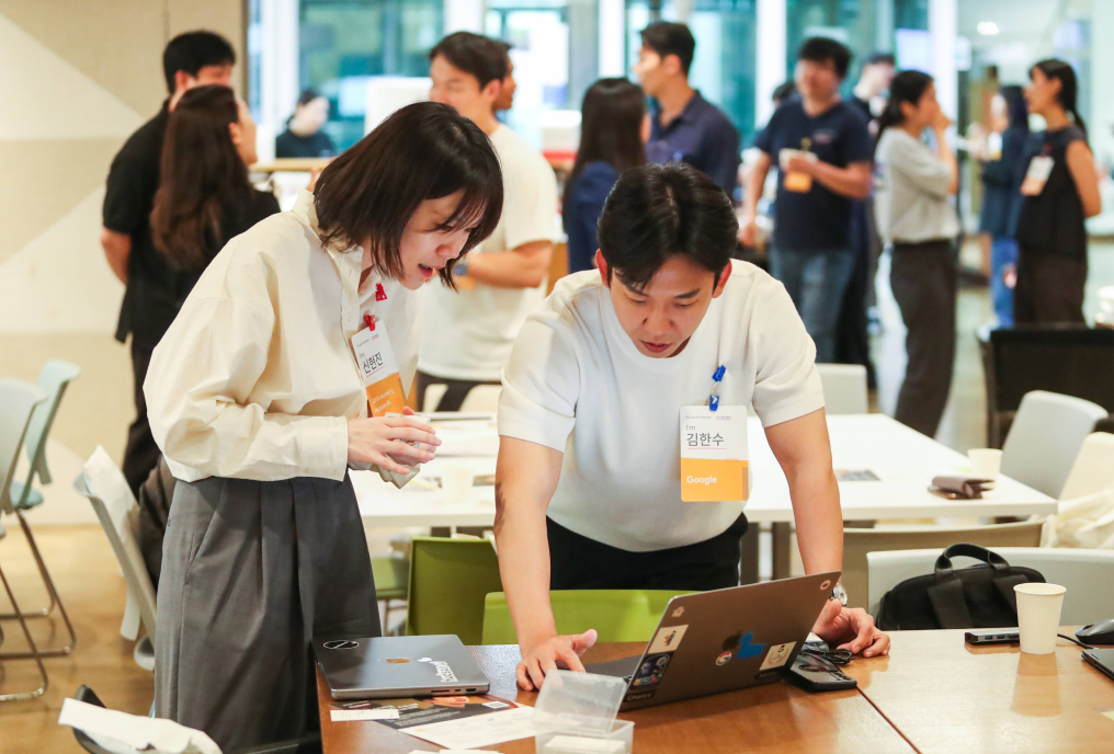 Man and women looking at laptop