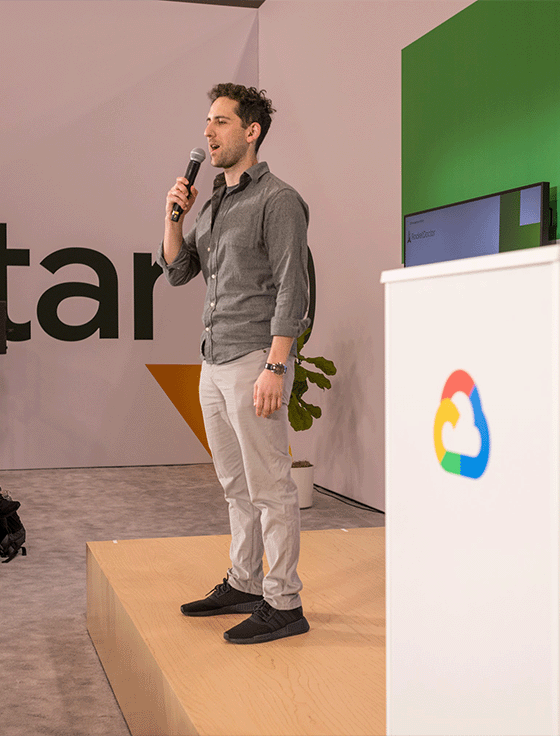 Holding a microphone, the host is managing the event.