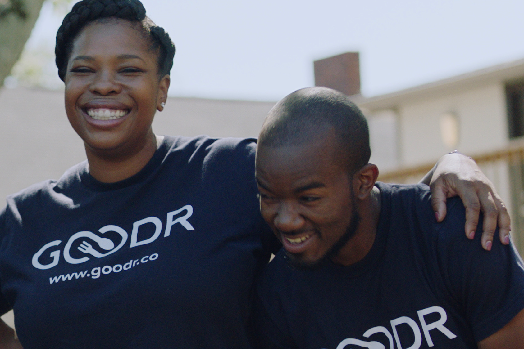 a woman and a man from Goodr smiling