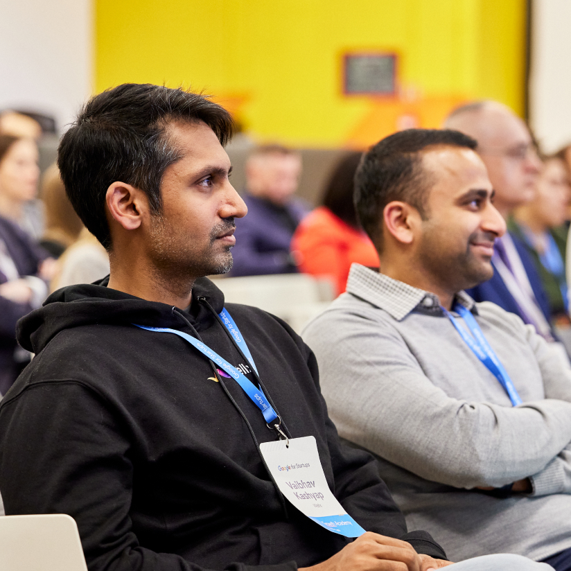 Group serious people listening intently conference