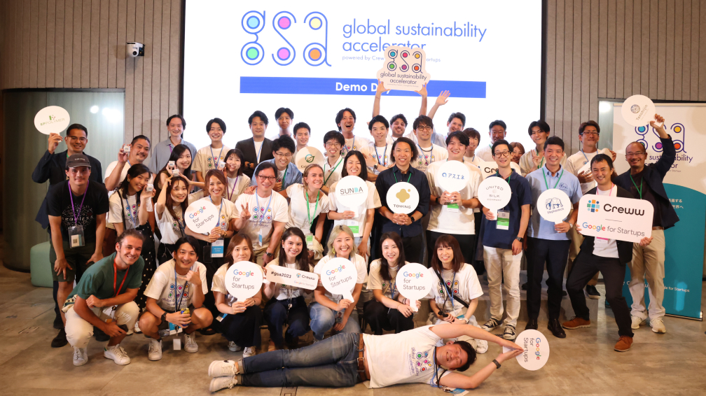 Group picture of happy people with google for startup cards in hand