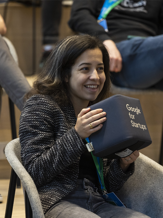A woman holding GFS gift box