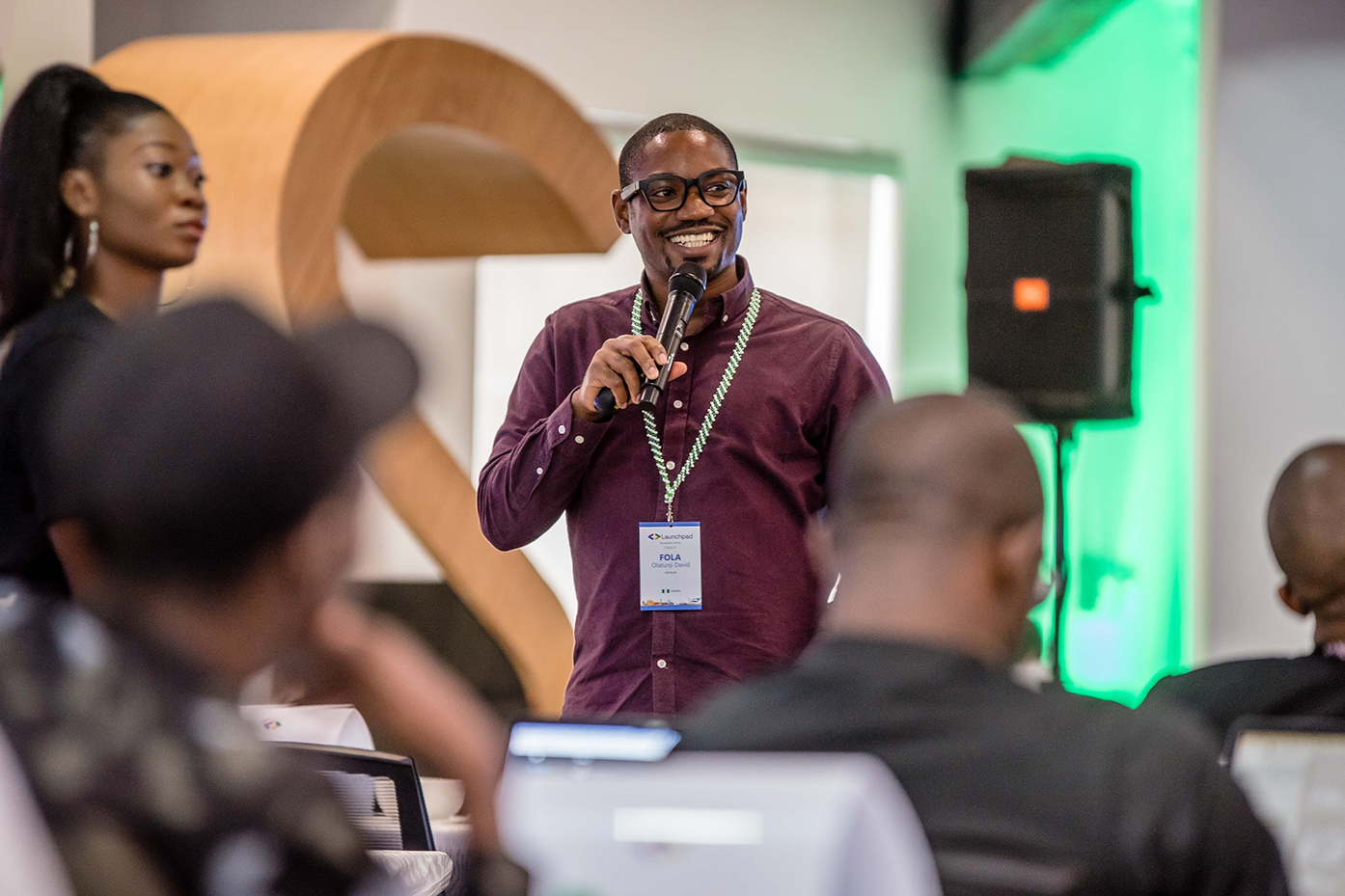 A person hosting an event while mice in his hand.
