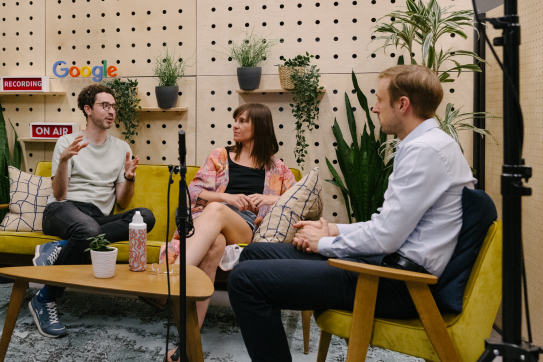 Couple of men and a women discussing something