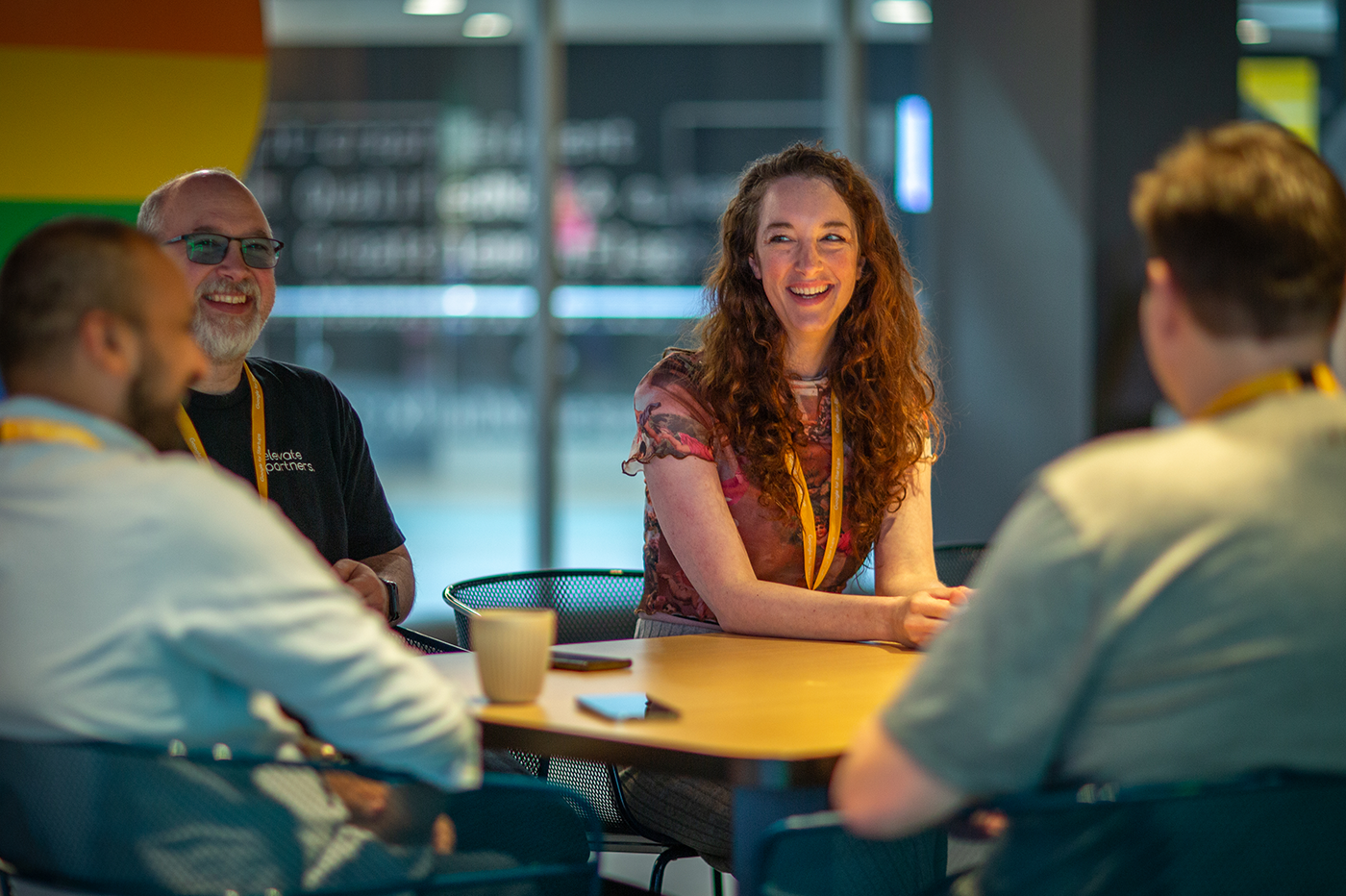 People seated at a table, enjoying a meaningful discussion.
