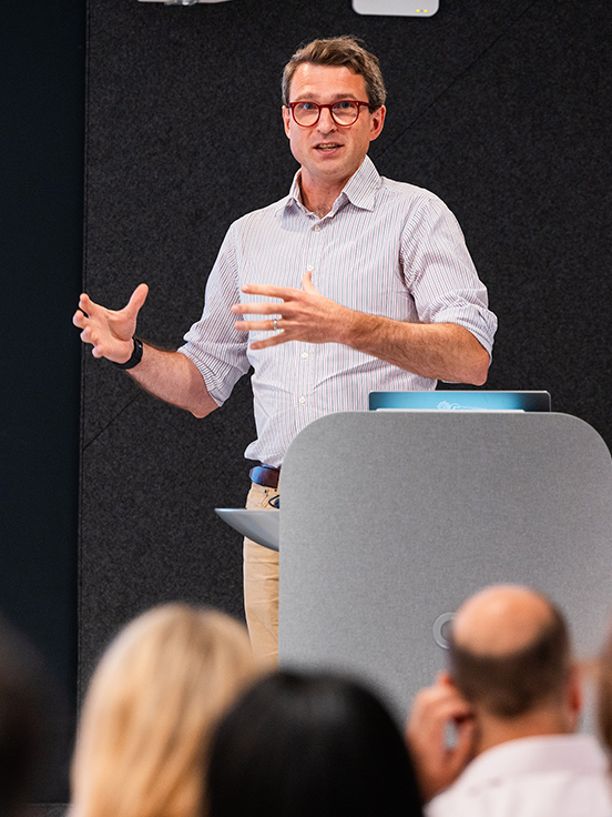 A person in glasses is leading a successful session at the event.