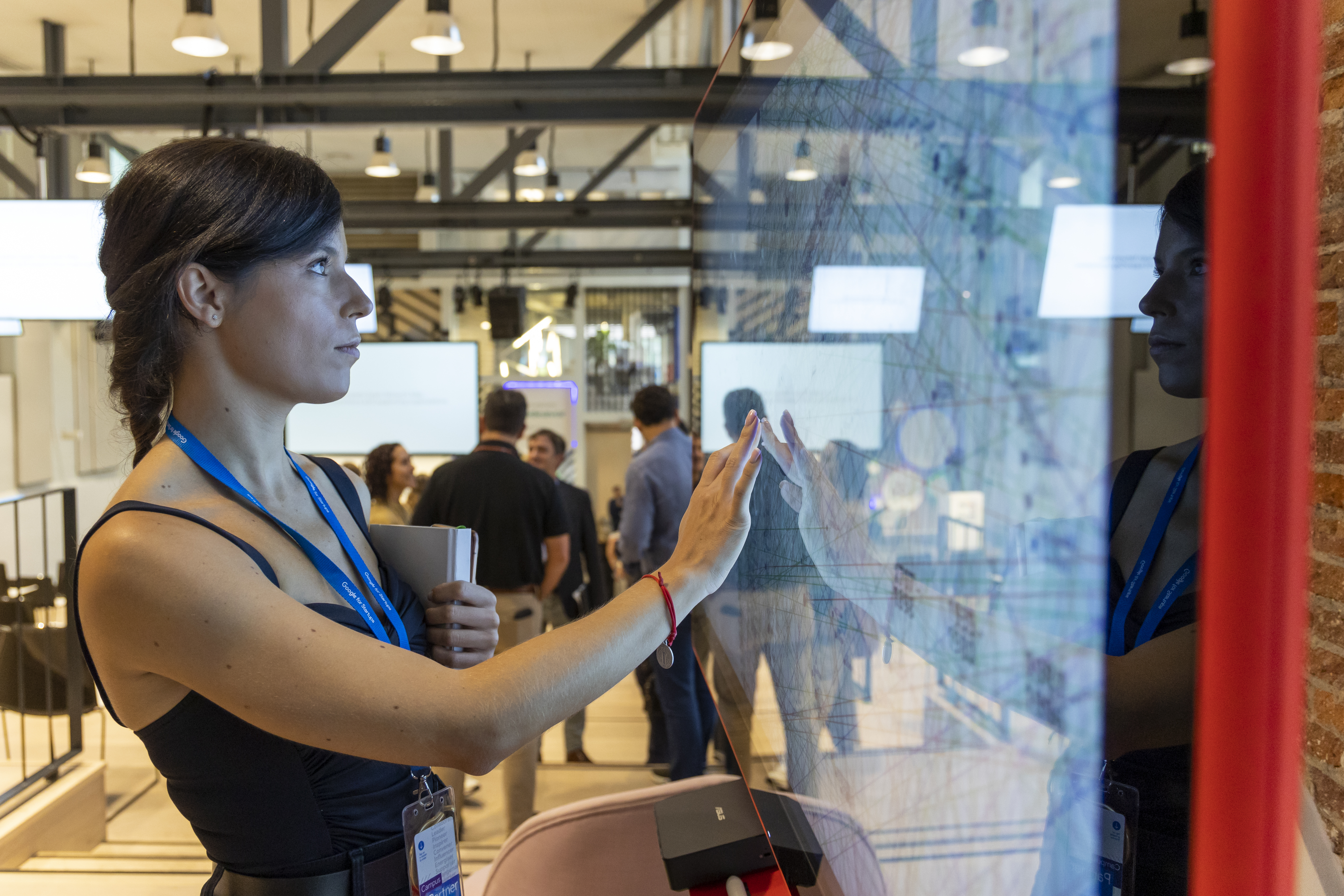 A lady is looking at white board.