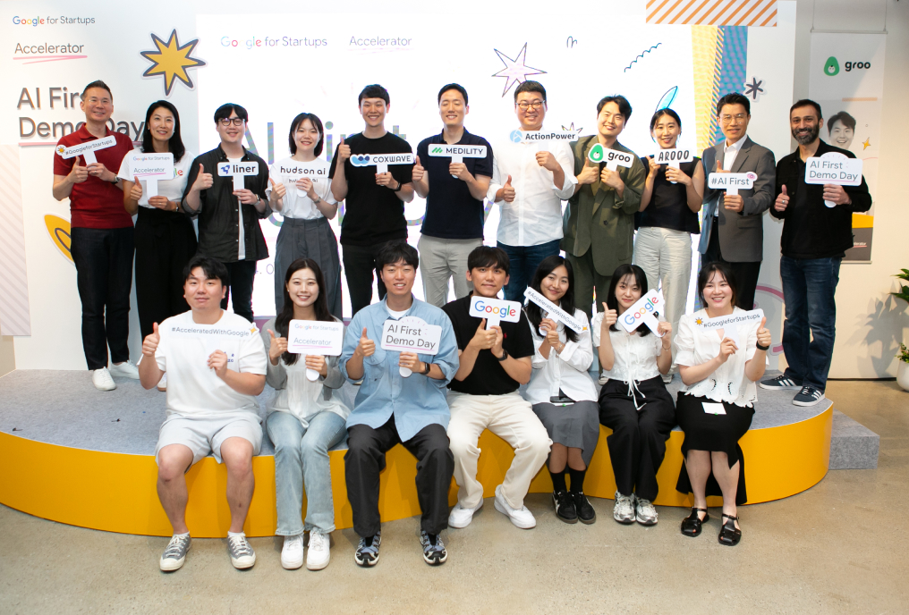 A group of peoples holding the event placards